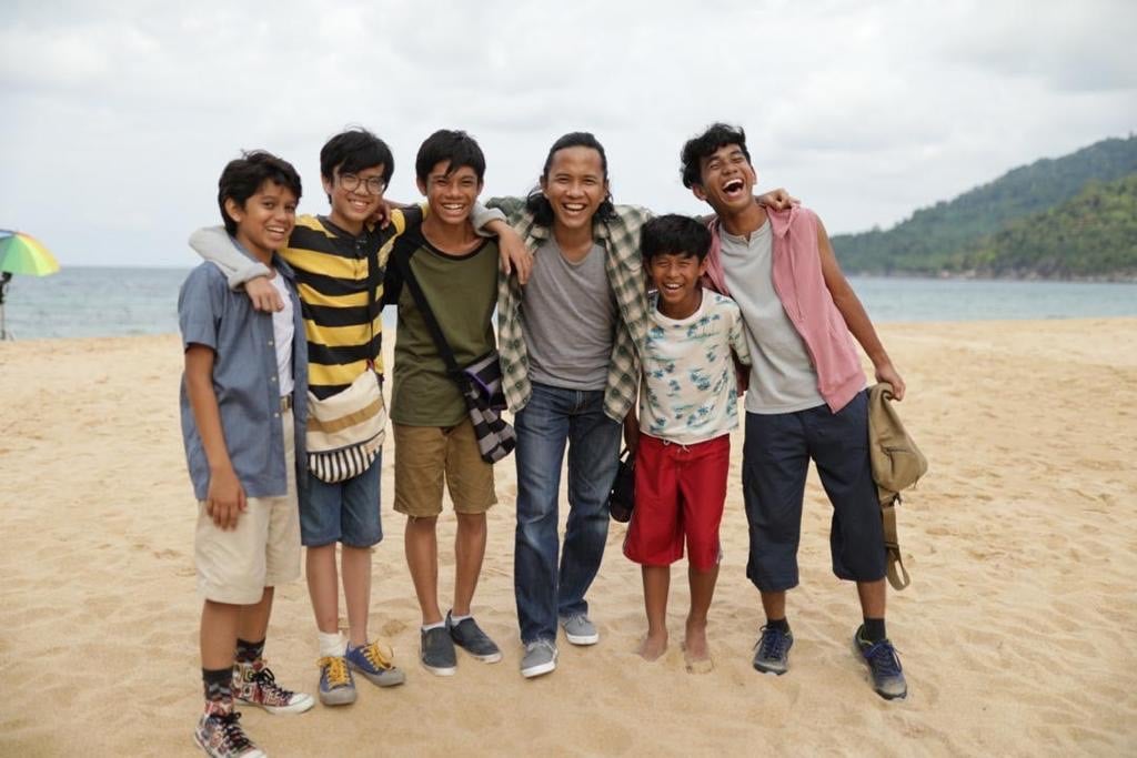 Omar with group of boys on beach blog 3