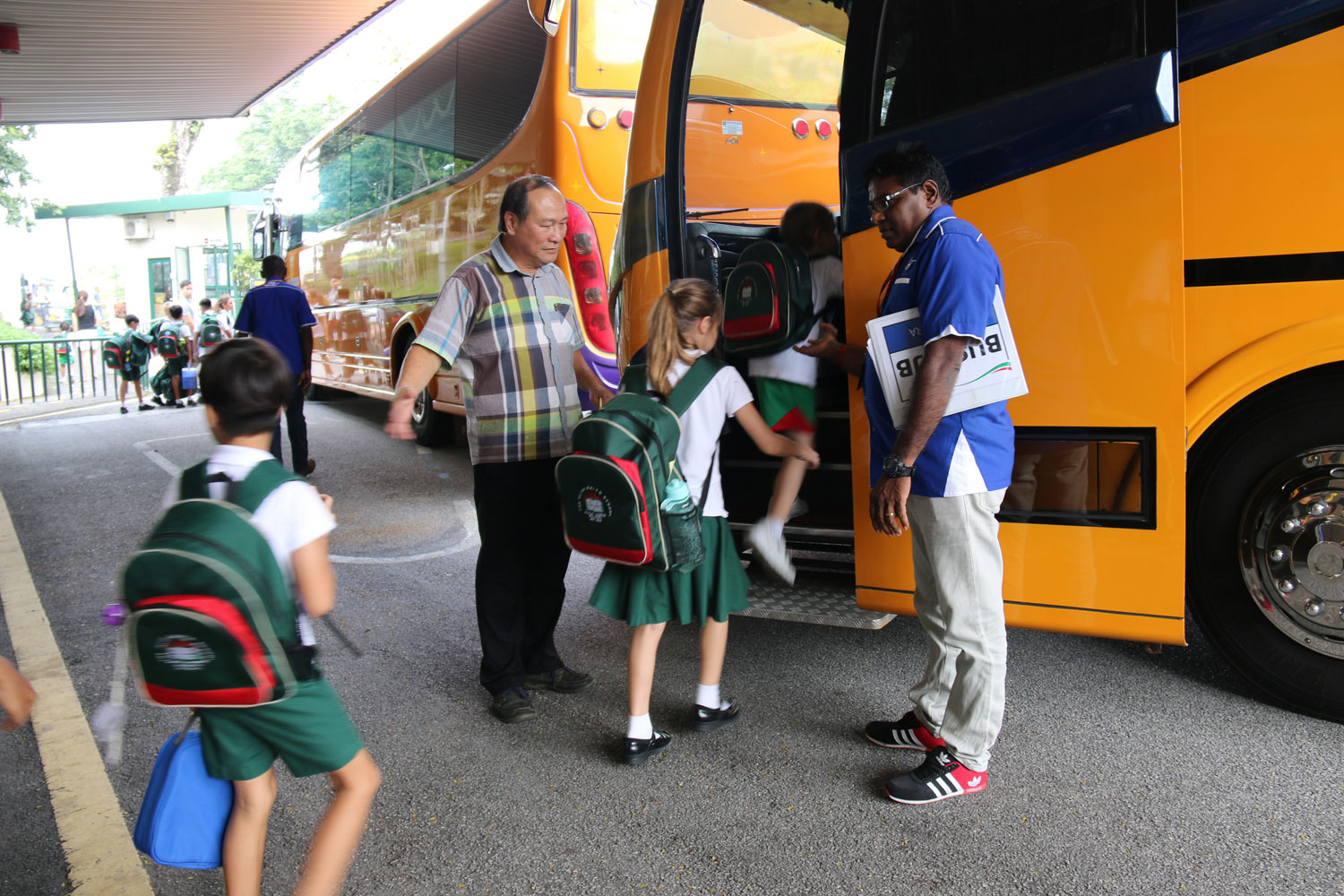 picture of students getting on the bus at Alice Smith School