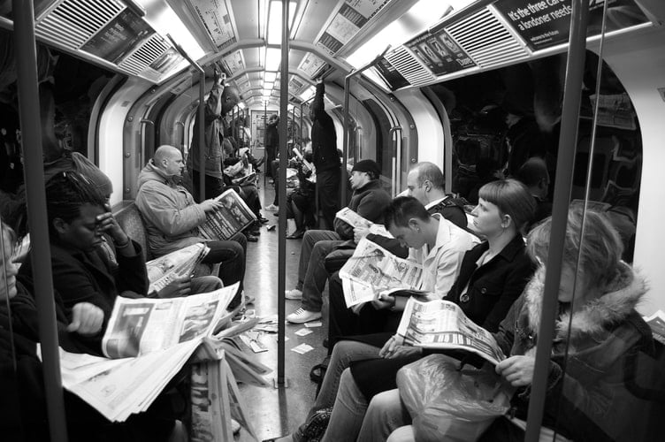 Passengers on the tube in Silence